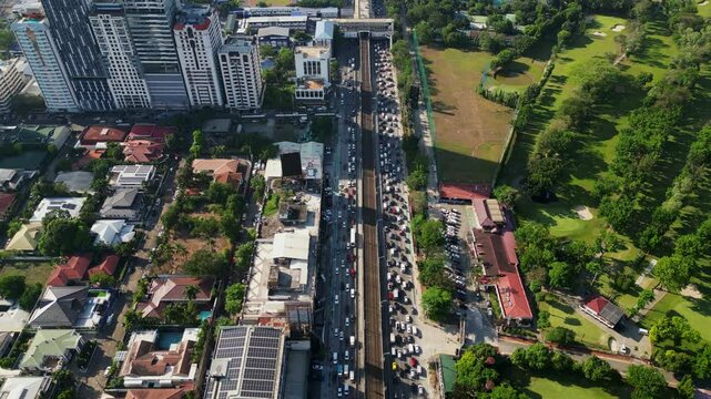 Overhead drone shot of busy EDSA Epifanio de los Santos Ave Highway during rush hour at Metro Manila, Philippines.