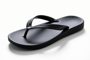 Single black flip-flop on white background, studio shot, travel, studio, leisure