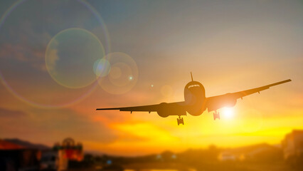 Commercial Airplane Landing at Sunset