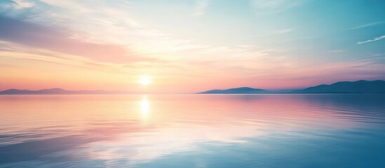 A serene pastel sunset over a calm lake reflecting the vibrant colors.