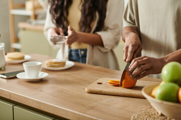 Cozy moments of love and connection in a warm kitchen with a joyful couple at home