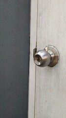 Close-Up of Silver Door Knob on Wooden Door
