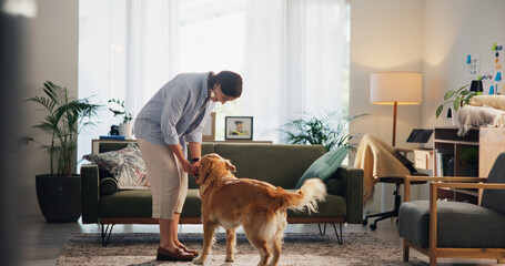 Love, care and dog with woman living room for petting, bonding and loyalty. Trust, animal adoption and relax with female person and golden retriever at home for support, domestic and happiness