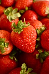 Bowl with organic strawberries – fresh seasonal fruit full of vitamins and natural flavor.