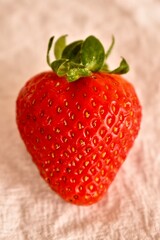 Ripe strawberry isolated on white – symbol of summer freshness and organic nutrition.