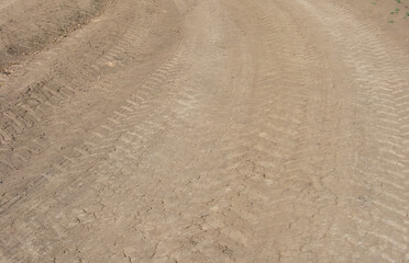 tire tracks on a dirt dusty road