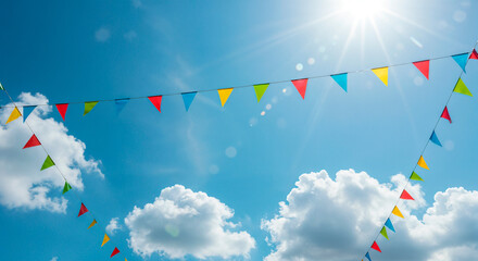 Colorful bunting flags adorning a bright summer sky filled with clouds