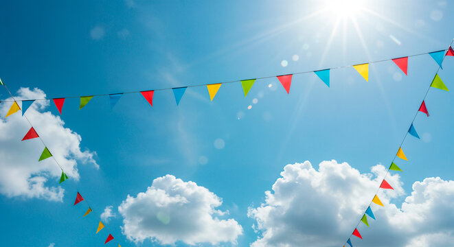 Colorful bunting flags adorning a bright summer sky filled with clouds