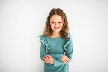 Portrait of a cute 6 or 7 years old girl over white background