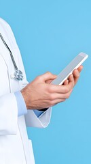 Doctor using a smartphone against a light blue background