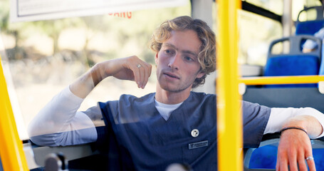 Commute, nurse and thinking with man on bus for journey or travel to healthcare job. Scrubs, shuttle and waiting with medical professional in hospital vehicle for public transportation to work