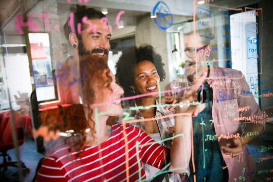 Team of programmers writing digital code in the metaverse and working together on the internet