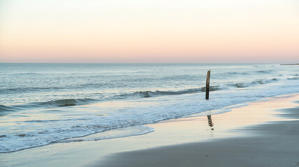 Serene sunset beachscape peaceful ocean waves gentle sand magical moment