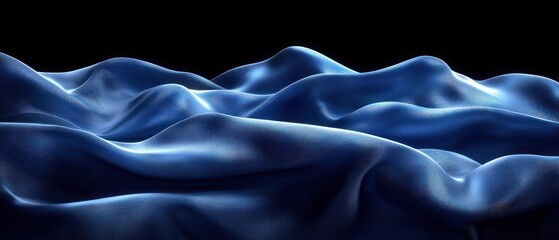Obraz premium Deep blue fabric draped in soft, flowing waves against a black backdrop. The texture is smooth and luxurious