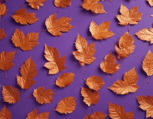 Fototapeta premium Dry orange metallic leaves scattered on a violet background, creating a textured autumnal pattern , botanical, october