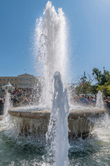 High jets of water from the fountain in Syntagma Square, Athens, Greece
