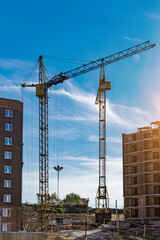 Extensive scaffolding providing platforms for work in progress on a new apartment block,Tall...