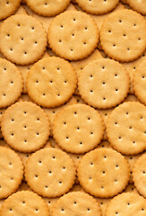 Macro shot of round salty cracker cookies. Snacks. Beer snack. Smooth rotation in a circle	
