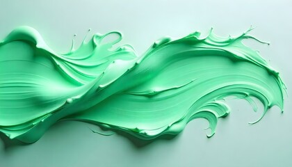 Close up view of light green paint swirls isolated on grey