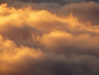Fototapeta premium The sun casts a warm glow on the cloud formation. The light creates a dramatic effect that captivates the viewer's attention. The sunlit clouds represent hope, peace.