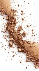 Crumbled light brown powder scattered against a white background, forming two diagonal lines