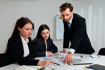 Business Meeting with Four People in Office Setting