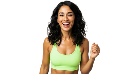 A happy, fit woman in her 30s or 40s with dark curly hair smiles broadly while wearing a bright green sports bra against a transparent background, looking energetic and healthy.