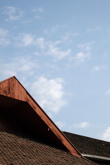A simple sky seen through a wooden roof that shows the passage of time, perhaps at Kornets Hus.