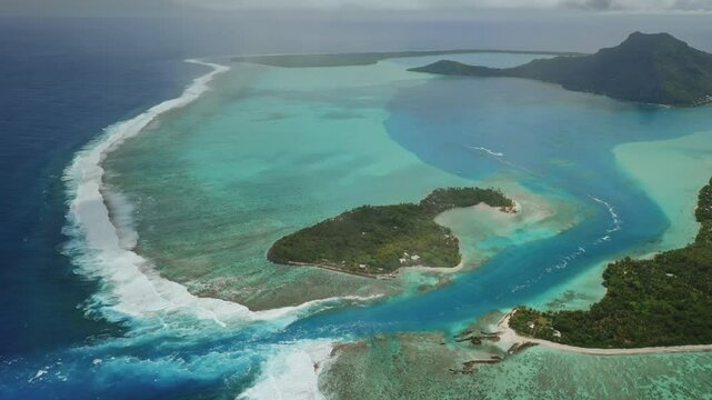 Stunning aerial view capturing huahine, French Polynesia, with lush tropical islands surrounded by vibrant coral reefs and crystal-clear turquoise waters