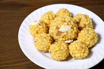 Traditional Indian Boondi Laddu on White Plate – Festive Sweet Delight