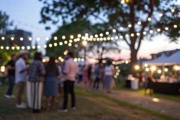 Evening social gathering with twinkling lights outdoor park blurred background vibe