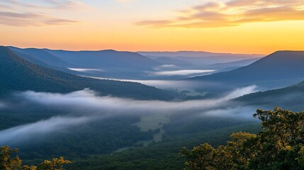 Fog-Kissed Valleys: A Serene Mountainscape at Sunrise Showcasing Nature's Beauty