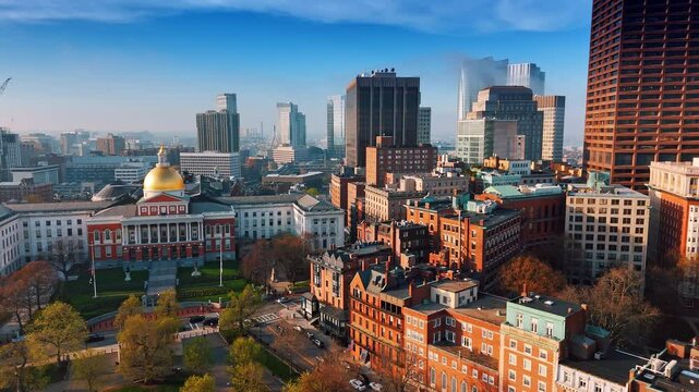 Beautiful architecture of modern Boston on sunny day. Approaching the building of Massachusetts State House. Aerial view.