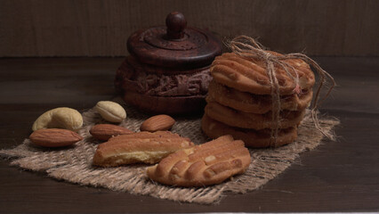 Tasty Cookies with sesame seeds on wooden board. Healthy vegan cookies.