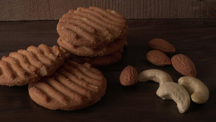 Tasty Cookies with sesame seeds on wooden board. Healthy vegan cookies.
