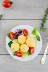 Lush egg omelette with lettuce and tomatoes on a plate