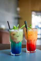 Two cold non-alcoholic cocktails, blue and red in the restaurant