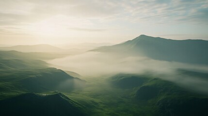 Fototapeta premium Serene mountain range covered by a blanket of fog during sunrise atmosphere
