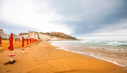 View of the Italian town of Vieste during a storm and cloudy weather. Sad atmosphere of the popular holiday destination Vieste.