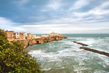 View of the Italian town of Vieste during a storm and cloudy weather. Sad atmosphere of the popular holiday destination Vieste.