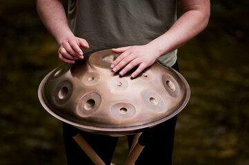 handpan outdoors near a waterfall