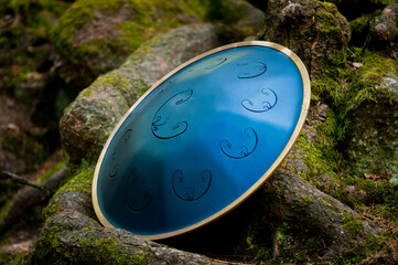 handpan outdoors near a waterfall