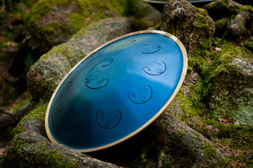handpan outdoors near a waterfall