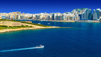 Panoramic view with a ship passing Manoel Island towards Sliema, Malta
