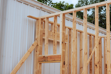 Workers continue building wooden frame beams structure in under works day