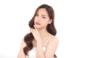 Fototapeta premium A beautiful young Asian woman with clean, fresh skin against a white background. Skincare, facial treatment, cosmetology, beauty, and spa. An elegant portrait of an Asian woman.