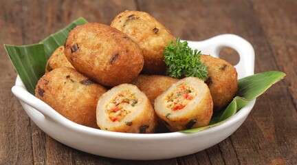 Combro is made from grated cassava which is shaped round or oval and filled with oncom and chili sauce and then fried.