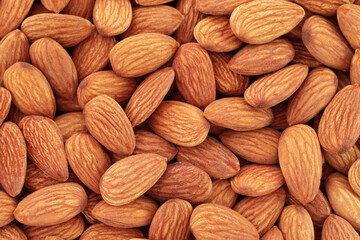 Background of Almonds nuts close-up, natural and healthy food concept for backgrounds and backdrops