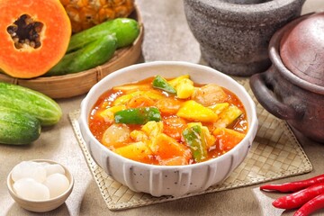 Rujak kweni or rujak aceh is a type of typical Acehnese rujak made from mashed kweni mango with chili, sugar, salt and tamarind juice.