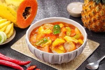 Rujak kweni or rujak aceh is a type of typical Acehnese rujak made from mashed kweni mango with chili, sugar, salt and tamarind juice.